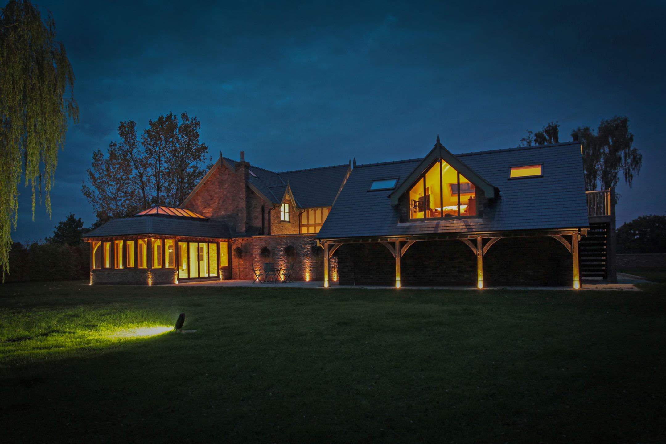 superb night lighting in outside one of our beautiful cheshire builds